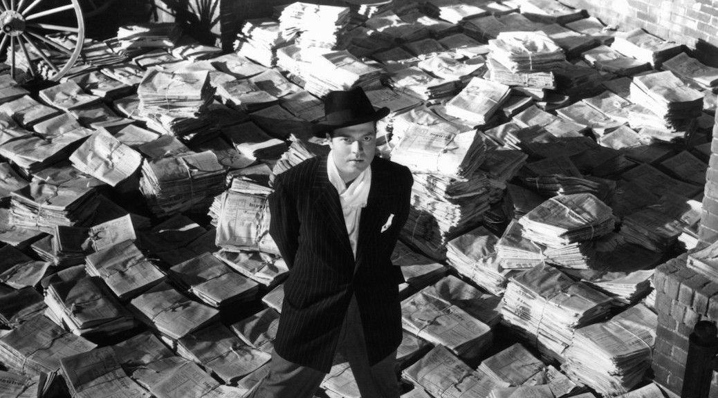 Orson Welles standing on stacks of newspapers in a scene from the film 'Citizen Kane', 1941. (Photo by RKO Radio Pictures/Getty Images)